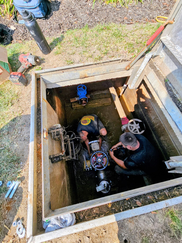 Toledo's Rooter Right Plumbing and Drain team is hard at work replacing a backflow system on a local sewer and drain line